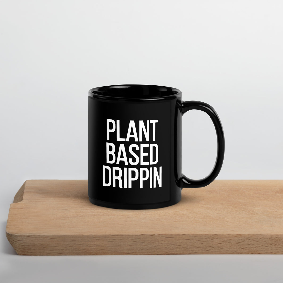 http://plant-based-drippin.myshopify.com/cdn/shop/products/black-glossy-mug-black-11oz-handle-on-right-642873519ca9d_1200x1200.jpg?v=1680372570